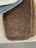 Chocolate coloured carpet on showcase in a Coventry carpet shop
