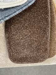 Chocolate coloured carpet on showcase in a Coventry carpet shop